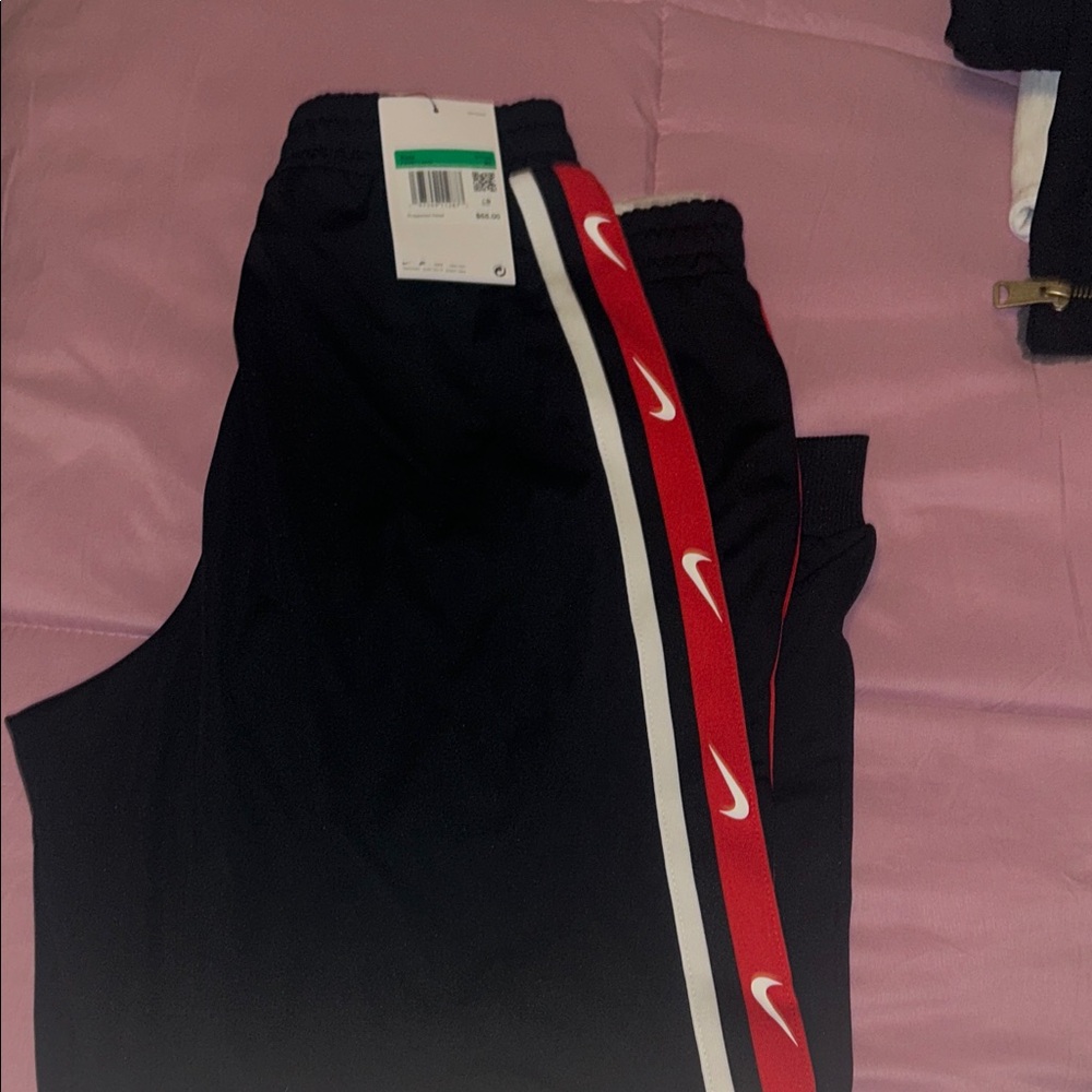 Nike Kids Black Joggers with Red and White Side Stripes